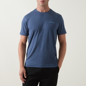 Model wearing Columbia Parons Logo Back Graphic T-Shirt in Collegiate Navy, round neck, short sleeves, styled with black joggers.
