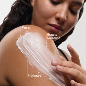 Model applying Elemis Pro-Collagen Marine Body Cream to shoulder, with text callouts highlighting firms, hydrates and boosts radiance benefits