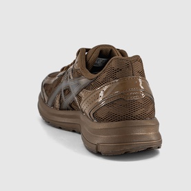 Asics trainer in brown, mesh and synthetic upper, chunky brown sole, silver logo detail, rear three-quarter view