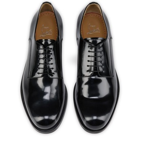 Christian Louboutin black high-shine leather Oxford shoes, overhead flat lay showing lace-up front, tan leather insole and white sole detail