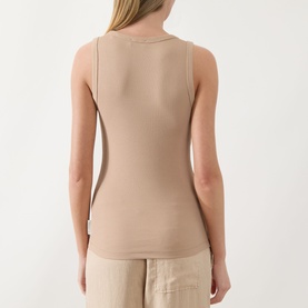 Model wearing Marc O Polo Solid Logo Tank Top in Sandpaper, back view, showing ribbed finish, scoop neckline and sleeveless design, styled with beige
