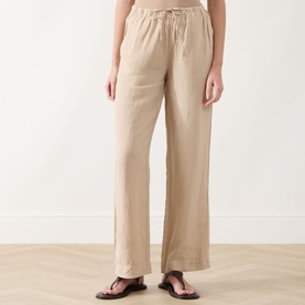 Model wearing Marc O Polo Linen Straight-Leg Trousers in Sandpaper, mid-rise with elasticated drawstring waist, styled with brown sandals