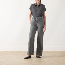 Model wearing Marc O Polo Linen Straight-Leg Trousers in Slate Grey Melange, mid-rise with drawstring waist, styled with grey shirt and black ballet