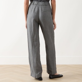 Model wearing Marc O Polo Linen Straight-Leg Trousers in Slate Grey Melange, rear view showing elasticated waistband and straight leg; styled with