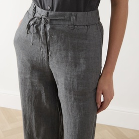Model wearing Marc O Polo Linen Straight-Leg Trousers in Slate Grey Melange, mid-rise with drawstring waistband and belt loops visible