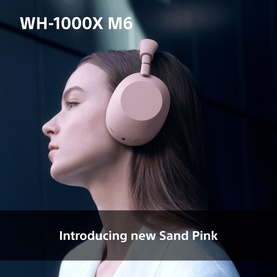 Model wearing Sony WH1000 Mark 6 Noise Cancelling Bluetooth Over Ear Headphones in Sand Pink, shown in profile view