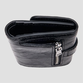 Maje red crinkled leather belt bag with silver zip hardware, shown open to reveal interior compartments