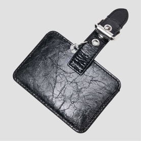 Maje luggage tag in red crinkled leather with buckle clip and contrast stitching detail