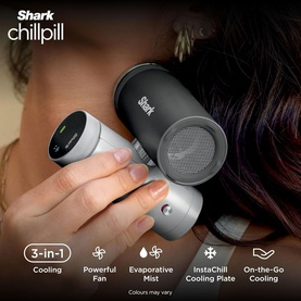 Model with Shark ChillPill 3-in-1 Fan Mist and InstaChill System Glacier, handheld personal cooling device in dark grey