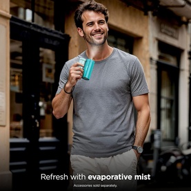 Model with Shark ChillPill 3-in-1 Fan Mist and InstaChill System Glacier, handheld teal device, worn with grey t-shirt outdoors