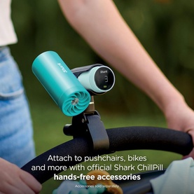 Shark ChillPill 3-in-1 Fan Mist and InstaChill System in teal, mounted on a bike handlebar with hands-free clip accessory.