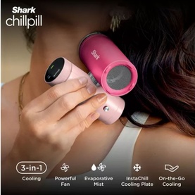 Model with Shark ChillPill 3-in-1 personal cooling device in pink and fuchsia, held to neck, showing fan and cooling plate features.