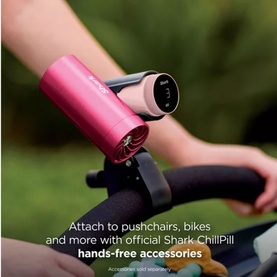 Shark ChillPill portable speaker in pink attached to a bike handlebar outdoors, with text highlighting hands-free accessories