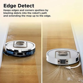 White robot vacuum and mop demonstrating Edge Detect feature, cleaning debris along a skirting board and wall edge on light wood flooring.