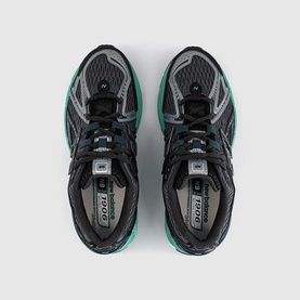 New Balance trainers in black metallic deep end, overhead view showing teal mesh upper, silver overlays, and cushioned insole.