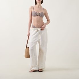 Model wearing Away That Day Cabo Verde Gingham Bikini Bottoms in espresso and ivory, low-rise with gold-tone hardware, styled with matching top and