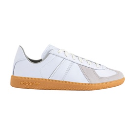 Adidas trainer in white leather with grey suede panels, three-stripe detail, white laces, and tan gum rubber sole.