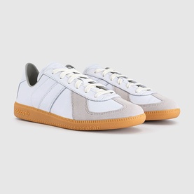 Adidas white leather low-top trainers with grey suede panels, white laces, and tan gum rubber sole, three-stripe detail.