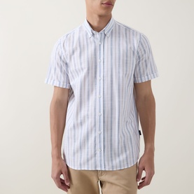 Model wearing Bugatti Stripe Slub Shirt in blue beige, short sleeves, button-down collar, stripe pattern, styled with beige chinos.
