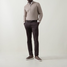 Model wearing Bugatti beige cotton half zip jumper, styled with dark trousers, white shirt, and brown suede loafers.