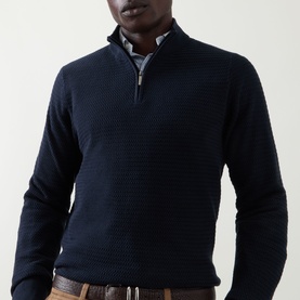 Model wearing Bugatti navy cotton half-zip knit jumper with textured stitch, styled with a collared shirt and tan trousers