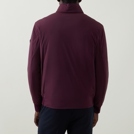 Model wearing Bugatti Black Berry outerwear jacket, rear view, ribbed collar and cuffs, navy trousers visible below