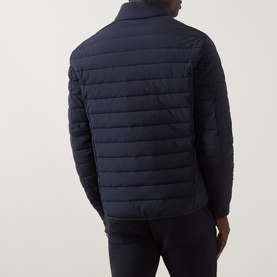 Model wearing Bugatti Zip Pocket Padded Jacket in navy, rear view showing quilted back panel, ribbed cuffs and funnel neck collar.