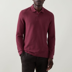 Model wearing Bugatti blackberry long-sleeve cotton polo shirt, styled with dark trousers