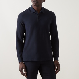 Model wearing Bugatti Logo Polo Shirt in navy, long-sleeve cotton with polo collar, two-button placket and embroidered logo detail.