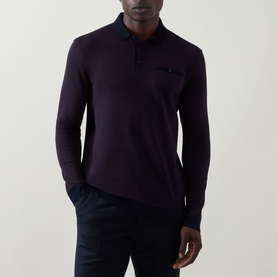 Model wearing Bugatti blackberry long-sleeve polo sweat with tonal collar and chest pocket detail, styled with navy trousers.