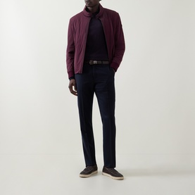Model wearing Bugatti blackberry zip-up sweat jacket, styled with navy trousers, dark knit and grey suede shoes.