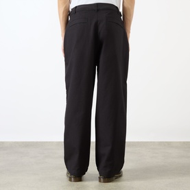 Model wearing Emporium Ripstop Fatigue Wide Leg Denim Trousers in black, wide-leg silhouette, back view, styled with brown boots.