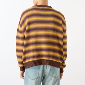 Model wearing Emporium Stripe Fisherman Knit Sweater in black, crew neck, bold horizontal stripes, heavyweight knit, styled with light blue jeans.