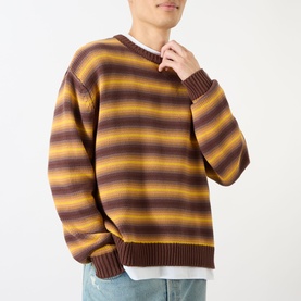 Model wearing Emporium Stripe Fisherman Knit Sweater in black, heavyweight crew neck with bold horizontal stripe pattern, ribbed cuffs and hem.