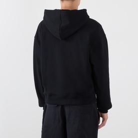 Model wearing Emporium Thermal Logo Hoodie in black, rear view, with matching black joggers. Pullover style with hood.