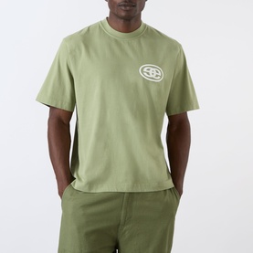 Model wearing Emporium EE Logo T-Shirt in khaki, with tonal EE oval logo print on chest, round neck and short sleeves, styled with matching khaki