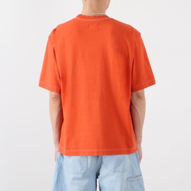 Model wearing Emporium Script Logo T-Shirt in orange with contrast stitching, back view, styled with light blue jeans.
