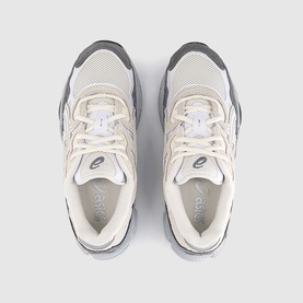 ASICS Gel-1130 trainers in cream and grey, mesh and leather upper, grey rubber sole, overhead flat-lay view