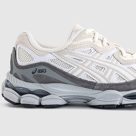 ASICS trainer in white and grey with mesh upper, suede overlays, and chunky grey sole, three-quarter view