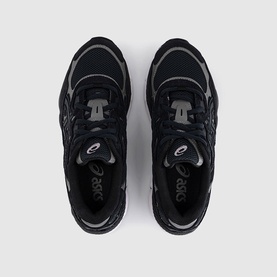 Asics trainers in Graphite Grey, overhead flat lay showing black mesh upper with silver branding and dark rubber sole.