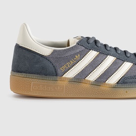 Adidas Handball Spezial trainers in grey suede with off-white three stripes, gold branding and gum sole, close-up detail view