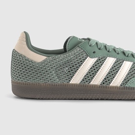 Adidas Samba trainers in silver green and white, featuring mesh upper, three white stripes, and gum rubber sole