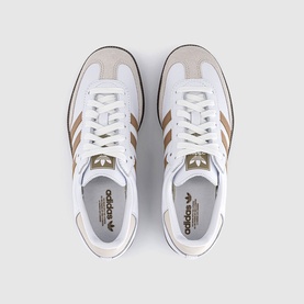 Adidas trainers in white and cardboard with gum sole, overhead view showing lace-up front and trefoil branding on tongue