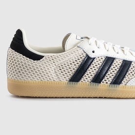 Adidas Samba trainer in off-white mesh with carbon navy three stripes, gum sole, white laces, close-up detail view