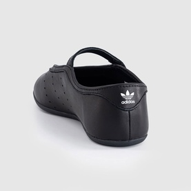 Adidas black perforated leather ballet flat with velcro ankle strap, white Trefoil logo, black sole, rear view.
