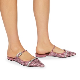Model wearing Kurt Geiger London Strass Pointed Flat Mules in pink metallic fabric with pink crystal embellishment and silver crystal buckle strap