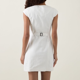 Model wearing Aligne Jennie Shirt Dress in white, rear view showing belted waist, cap sleeves and mini length.