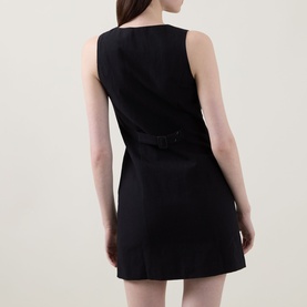 Model wearing Aligne Leah Mini Dress in black, shown from behind highlighting the tab adjustable back detail and mini length.
