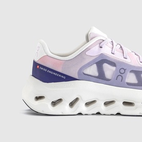 On Running trainer in Orchid Ivory, featuring gradient purple-to-white upper, Swiss Engineering branding, and chunky white CloudTec sole.