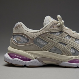 Asics trainer in white and taro purple, featuring suede and mesh upper with silver logo detail and chunky purple-accented sole